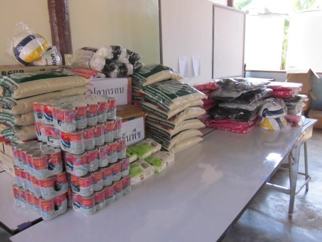 Sacks of rice and boxes of supplies stacked for delivery